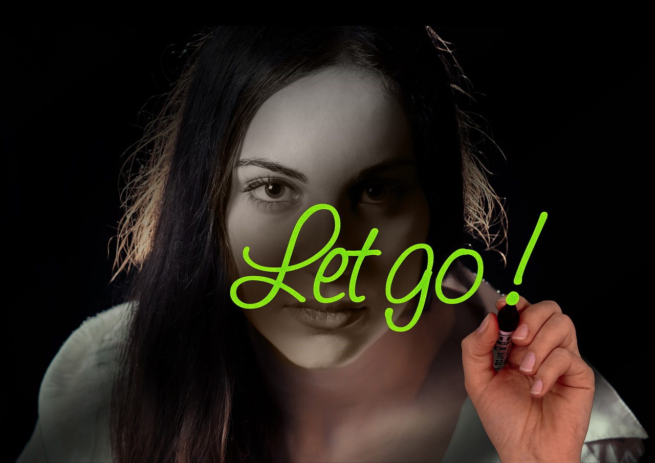 woman face head hand write glass word let go submit freedom cancel to let reveal to let yourself fall despair let drive let go let go let go let go let go