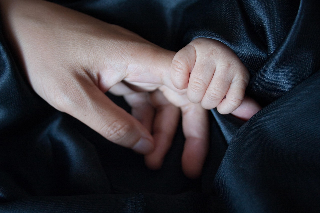 touch  holding hands  happy mothers day  affection  caring  care  love  parent  parenting  family  child  mom  mum