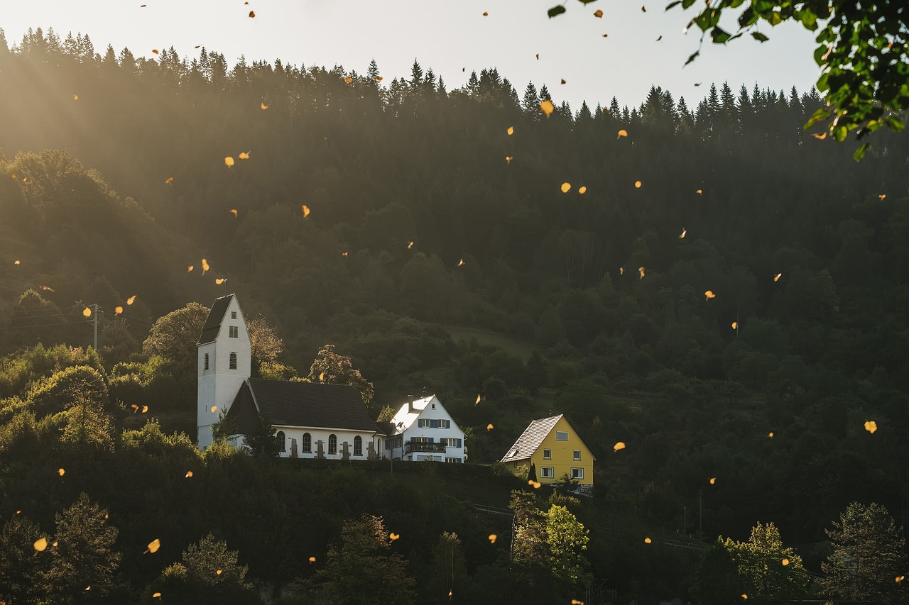 fall leaves are falling golden landscape church houses sunrise forest light sunbeams sunlight black forest nature fall church church church church church